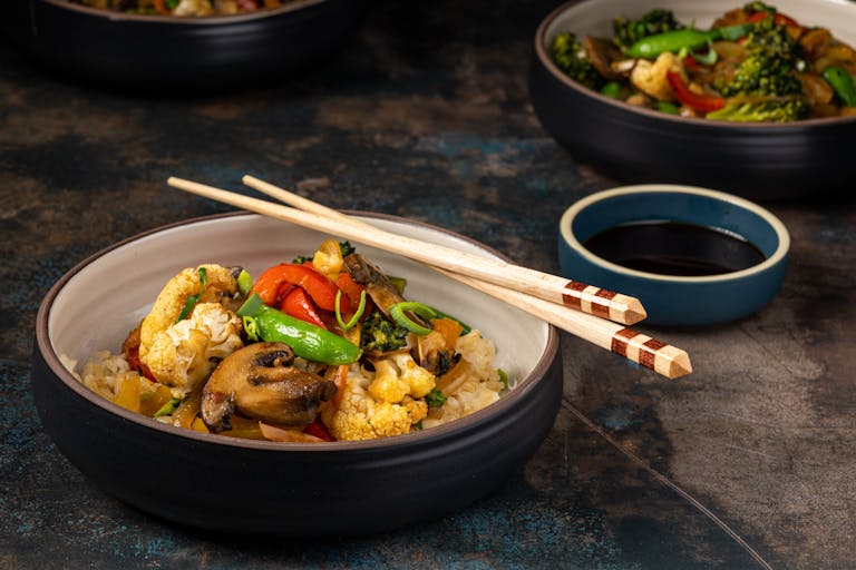 Delicious mixed vegetable stir fry with rice, perfect for a healthy meal.